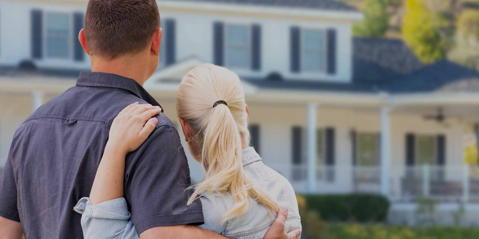 a couple looking at their house